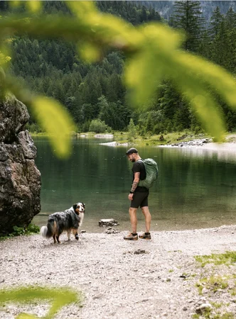 dog oslo with his owner at the lake